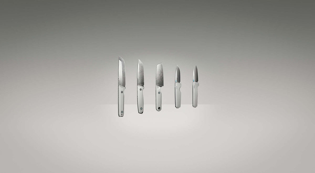 Leatherman Knives the full collection suspended in space infront of a grey background. The knives are arranged from largest to smallest. 