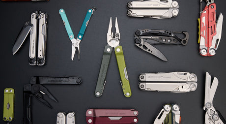 Translation missing: en.Various Leatherman tools arranged on a black surface