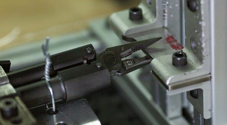 Translation missing: en.A Leatherman multitool pliers being tested for strength