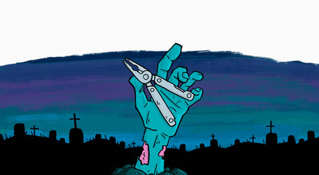 Translation missing: en.A zombie hand holding a multi-tool in a graveyard
