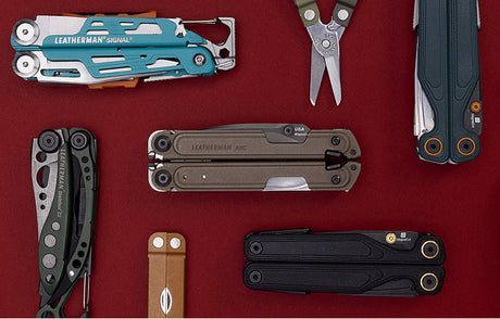 Translation missing: en.A variety of Leatherman tools in different styles are arranged on a vibrant red surface