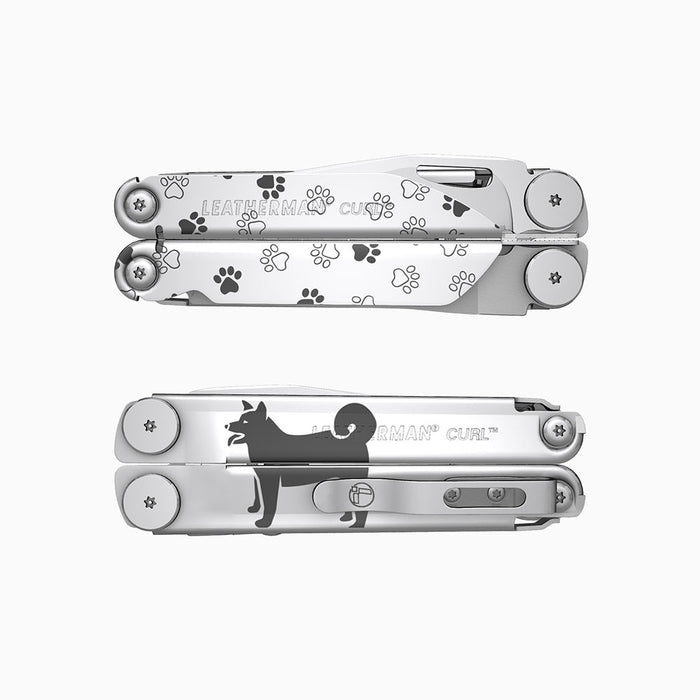 Translation missing: en.A stainless steel Leatherman Curl multitool engraved with playful pawprints and a silhouette of a dog. 