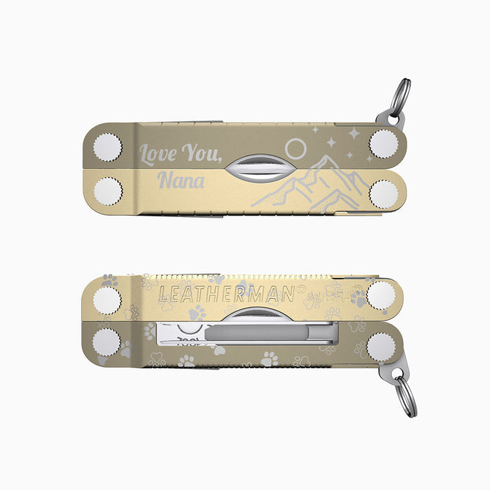 Translation missing: en.A two-tone cappuccino-colored Leatherman Micra multitool engraved with mountains, pawprints, stars, and the message “Love You, Nana.” 