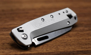 Translation missing: en.Leatherman FREE K4X, knife on table, silver, closed